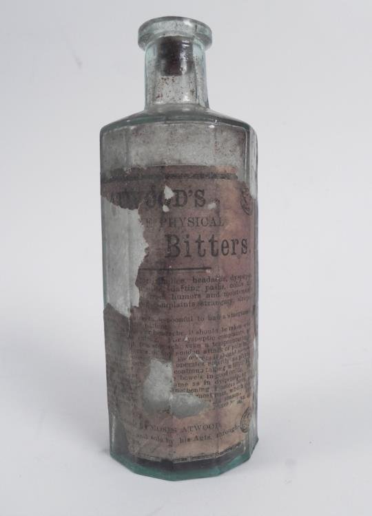 Atwoods Jaundice Bitters Old Medicine Bottle w/Label: What makes this Atwoods Jaundice Bitters medicine bottle extra special is that it retains most of its original paper label on back. There is also a portion of cork at the neck. The body and shoulder o