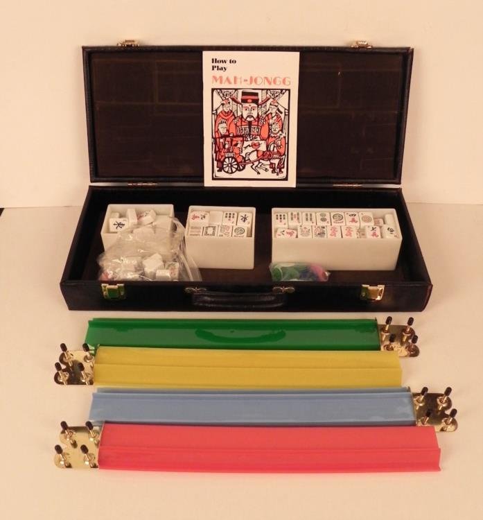 Vintage Mahjong Game Set in Case 166 Tiles Mah Jongg: This is a vintage Mah Jongg set, and it comes complete in the original carry case. The case is lizard pattern black padded vinyl, with brass tone latches. The inside has three separate containers for 