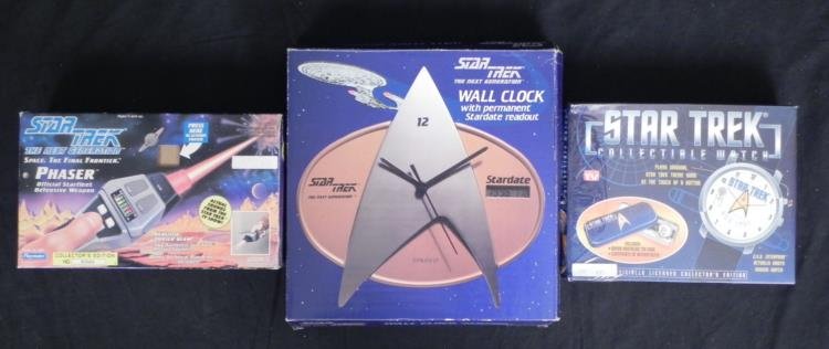 3 Star Trek Items: Phaser, Watch, Wall Clock MIB: Here are three great Star Trek collector items, all in mint condition in the original boxes. Included are: Next Generation Phaser, numbered collector's edition from Playmates, 1992 Watch, with Enterpr