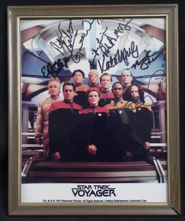 Star Trek Voyager Cast Signed Framed Photo w/COA: This promotional photo was signed by 9 original cast members of the sci-fi adventure series "Star Trek Voyager." The autographs are all in black marker. They include Kate Mulgrew, Robert Beltran, Roxa