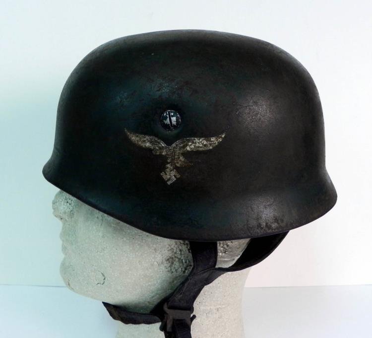 WWII Rare Luftwaffe Paratrooper Helmet.: This Luftwaffe Paratrooper helmet has the complete liner and strap, all of which are in very good condition. The word Kuhnast is written on the front, which possibly was the paratroopers name. We can 