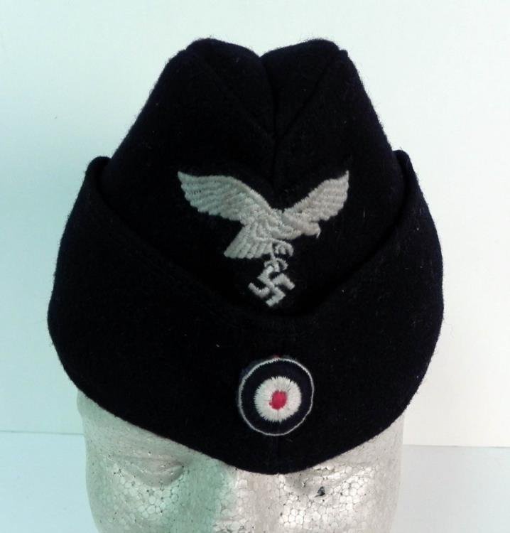 WWII German Nazi Luftwaffe Cap: Offered is a WWII German Nazi Luftwaffe Cap. This is one of the better Luftwaffe caps we have seen, as it does not have a great deal of wear. It would make a fine addition to any military collection
