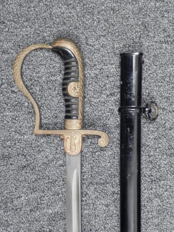 NAZI WEHRMACHT OFFICER DRESS SWORD-E PACK & SOHN,LANGET: NAZI WEHRMACHT OFFICER DRESS SWORD-E PACK & SOHN 2/LOGO-EAGLE & SWASTIKA LANGET GREAT LOOKING WWII BRINGBACK--NAZI ARMY OFFICER'S SABER--WIRE WRAPPED BLACK GRIP--FANCY AND HAND DETAILED OAK LE