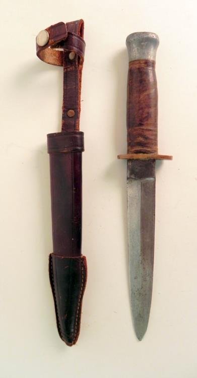 WWII German Knife/Dagger w/ Leather Handle and Scabbard: Available is this WWII German Knife or Dagger with a Leather Handle and Scabbard. This was possibly used as a boot knife. The whole thing measures about 10.5" long and the blade is about 5.5" long. Th