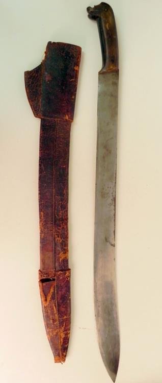 Large Old South American Machete w/ Leather Scabbard: Offered here is this Large Old South American Machete with its Leather Scabbard. The entire knife is about 32" and the blade itself is 26.5" long. The handle is starting to come apart and the sca