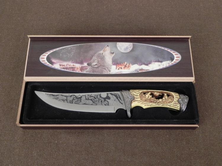 LARGE ETCHED BLADE HUNTING KNIFE-CUT OUT WOLF GRIP,CASE: LARGE ETCHED BLADE HUNTING KNIFE-CUT OUT HOWLING WOLF GRIP-DECORATIVE POMMEL-W/CASE APPROX 11" KNIFE WITH WOLVES, FULL MOON AND MOUNTAINS MOTIF IN ETCHED BLADE--CROSS CHECK EDGE-CHINESE CRAFTED-GRIP I