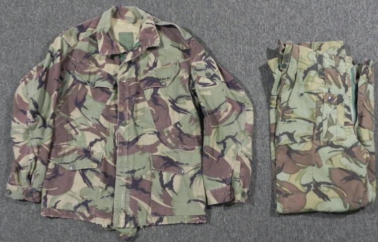 BRITISH ARMY CAMOUFLAGE COMBAT JACKET AND COMBAT PANTS: THIS IS A BRITISH ARMY CAMOUFLAGE COMBAT JACKET/SMOCK & COMBAT PANTS. IT HAS SEWN TAGS PRESENT ON THE SMOCK, BUT FADED & HARD TO READ. THE TROUSERS TAG READS "TROUSER'S MANS COMBAT