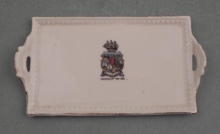 Westcliff On Sea Antique English China Vanitiy Tray: This early 20th century bone China vanity tray is a souvenir item from Westcliff On Sea. The transfer image has a colorful coat of arms. The size is 6 x 3 1/4". Its condition is excellent. This is a c
