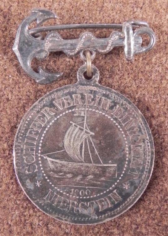 1900 IMPERIAL GERMAN NAVAL MEDAL-SILVER"SCHIFFERVEREIN: 1900 IMPERIAL GERMAN NAVAL MEDAL-"SCHIFFERVEREIN EINIGKEIT NIERSTEIN-HANGS FROM ANCHORGREAT 100+ YEAR OLD GERMAN NAVAL MEDAL IN SILVER-FOULED ANCHOR TOP-SUSPENDED MEDAL WITH OLD NAVAL SHIP -MEDAL 1 1/
