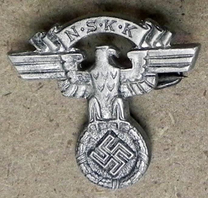 ORIGINAL NAZI NSKK MOTORCYCLE TROOPS MEMBERSHIP PIN: OFFERED HERE IS AN ORIGINAL NAZI NSKK MOTORCYCLE TROOPS MEMBERSHIP PIN. IT HAS A NSKK EAGLE & SWASTIKA WITH NSKK BANNER--REVERSE PINBACK & MARKED "M1/76-RZM".