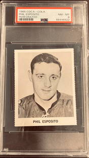 1965 Coca Cola Phil Esposito Perforated NNO PSA 8: The 1965 Coca-Cola Phil Esposito NNO is a rare regional issue featuring a young Esposito during his early career with the Chicago Black Hawks. Part of a limited promotional set distributed through Coc