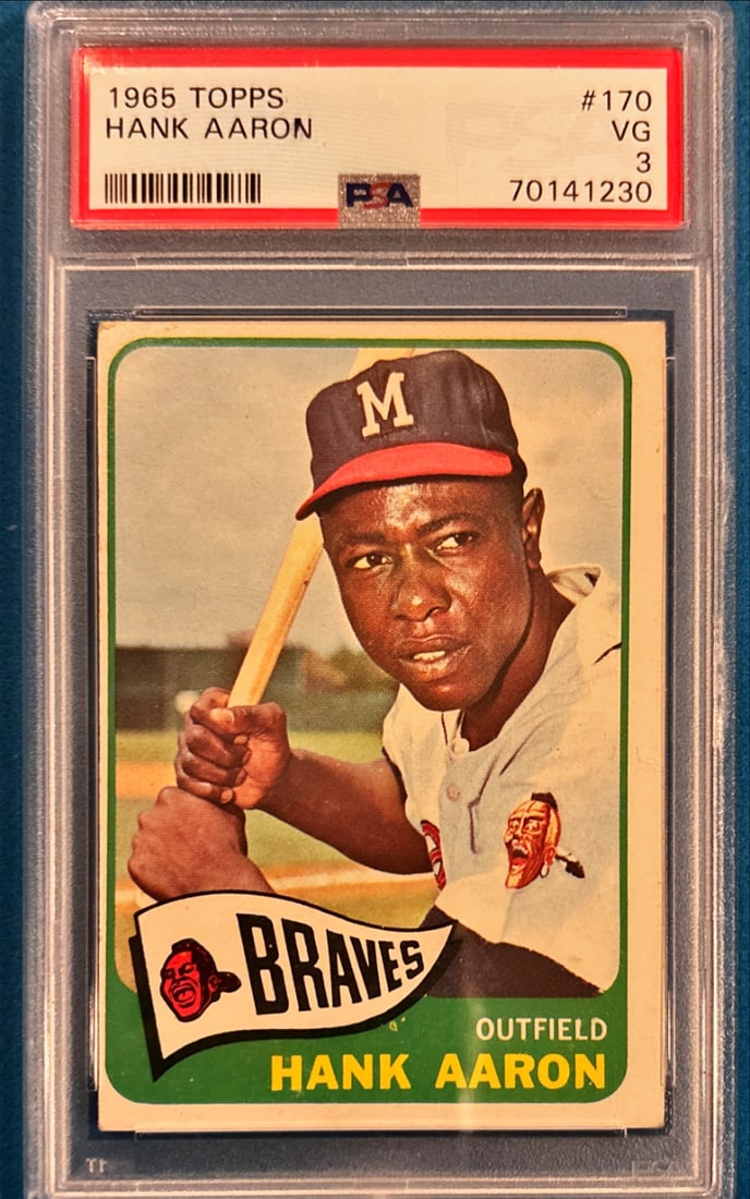 1965 Topps Hank Aaron #170 - PSA 3 VG: 1965 Topps Hank Aaron #170 - PSA 3 VG is a standout collectible that showcases Hank Aaron and represents an important piece of sports history. Cards from this era are prized for their classic design,