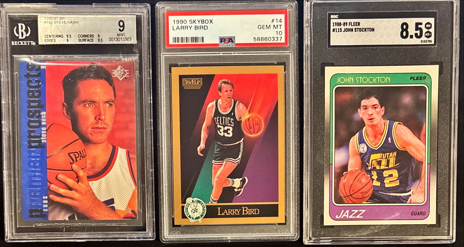 Lot of 3 NBA Legends – Nash / Bird / Stockton – BGS/PSA/SGC: This lot includes three graded basketball cards featuring Steve Nash, Larry Bird, and John Stockton:• 1996-97 SP Steve Nash #142 – BGS 9 (MINT)• 1990 SkyBox Larry Bird #14 – PSA 10 (GEM