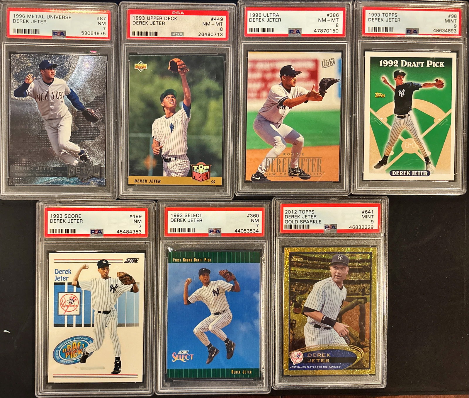 Lot of 7 Derek Jeter Graded Cards – PSA 9/8/7 Mix: This lot includes seven graded Derek Jeter cards:• 1996 Metal Universe #87 – PSA NM• 1993 Upper Deck #449 – PSA 8 (NM-MT)• 1996 Ultra #386 – PSA 8 (NM-MT)• 1993 Topps #98 –