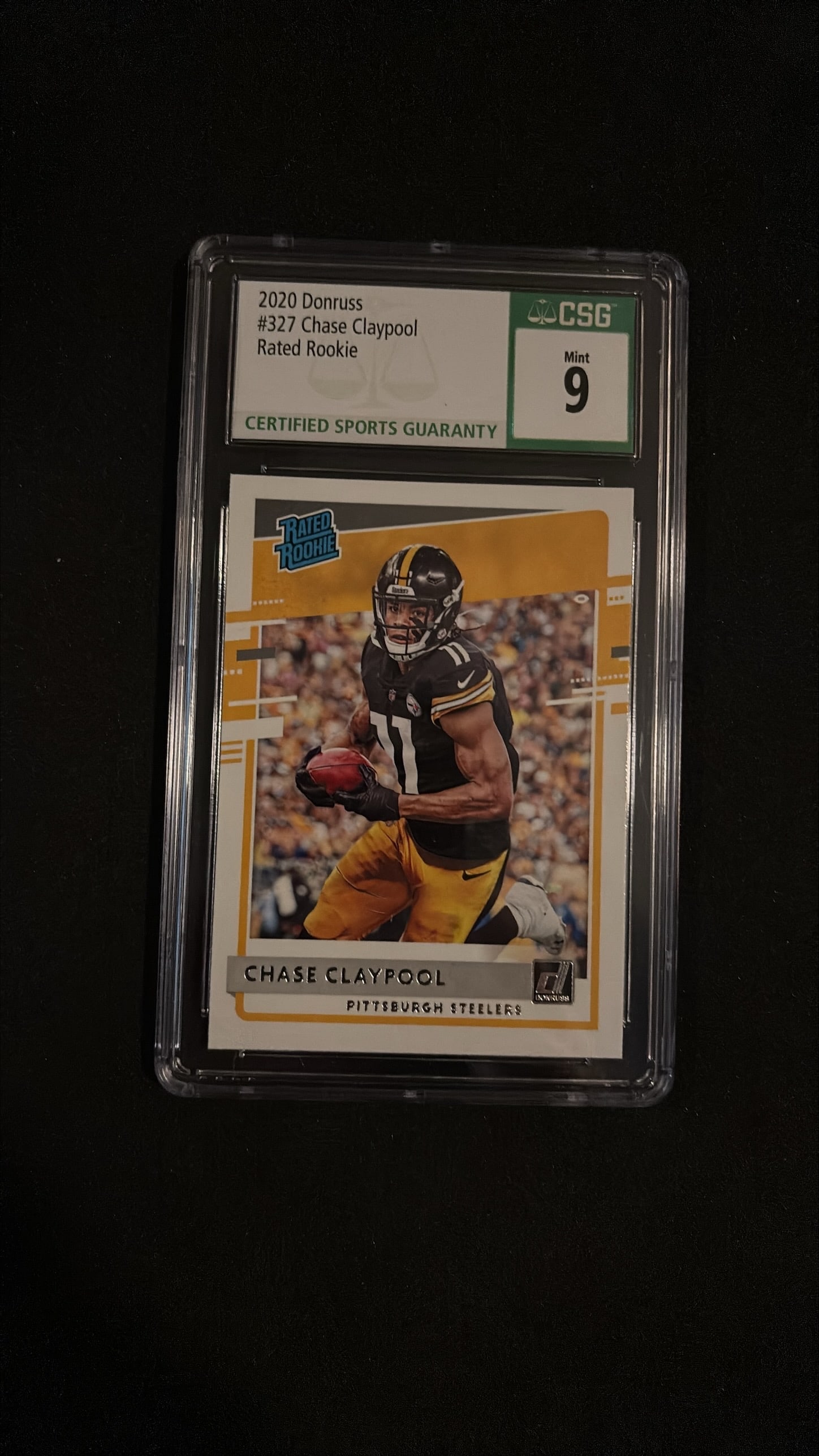 2020 Donruss Rated Rookie Chase Claypool #327 (CSG Mint 9): Offered is the classic Donruss Rated Rookie of Chase Claypool (#327) from 2020 Donruss Football. Encapsulated by CSG with a Mint 9 grade. A staple rookie card design for modern football collectors.