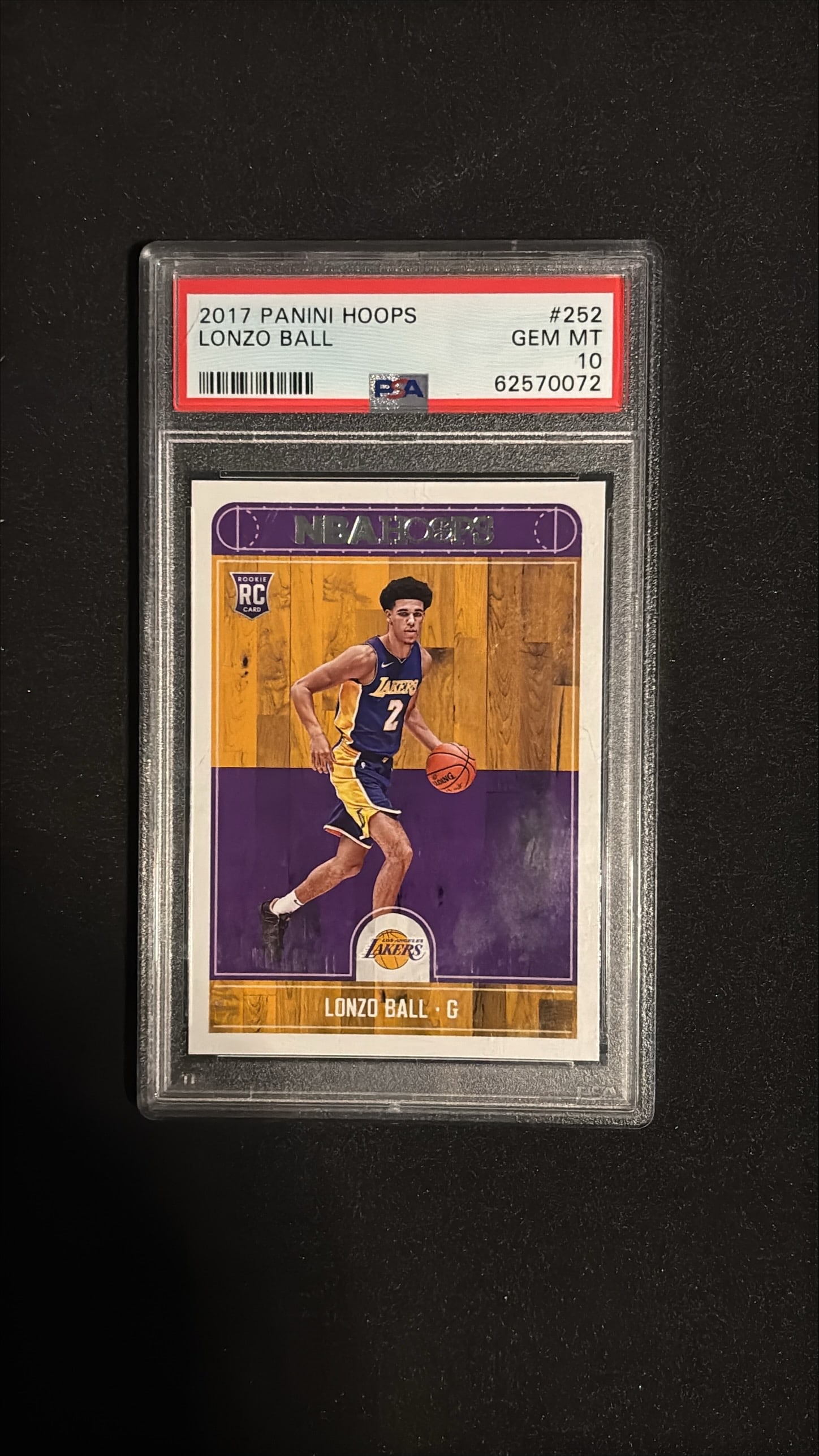2017 Panini Hoops #252 Lonzo Ball Rookie PSA 10 GEM MT: 2017 Panini Hoops #252 Lonzo Ball Los Angeles Lakers Rookie Card. Graded PSA 10 GEM MINT. An exceptional example of Ball's iconic rookie card from his Lakers debut season. Sharp corners, clean surface