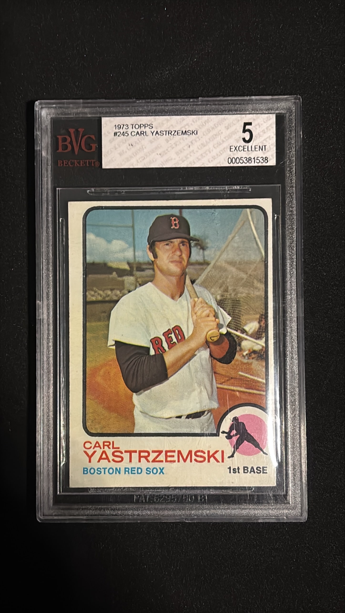 1973 Topps #245 Carl Yastrzemski BVG 5: 1973 Topps #245 Carl Yastrzemski graded BVG 5 (EXCELLENT). Boston Red Sox first baseman. Carl Yastrzemski is one of the greatest hitters in baseball history - a Hall of Fame legend, 1967 Triple Crown 