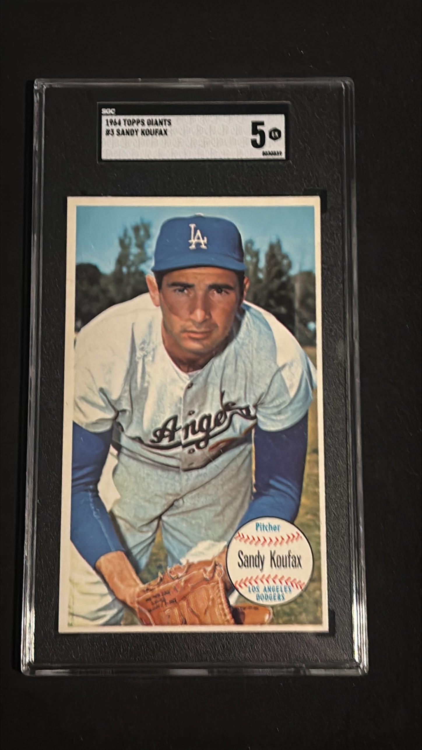 1964 Topps Giants #3 Sandy Koufax SGC 5 EX - Los Angeles Dodgers: 1964 Topps Giants #3 Sandy Koufax oversized baseball card, Los Angeles Dodgers. Graded SGC 5 EX with certification number 8484349. Koufax is one of the most iconic Hall of Fame pitchers in baseball hi