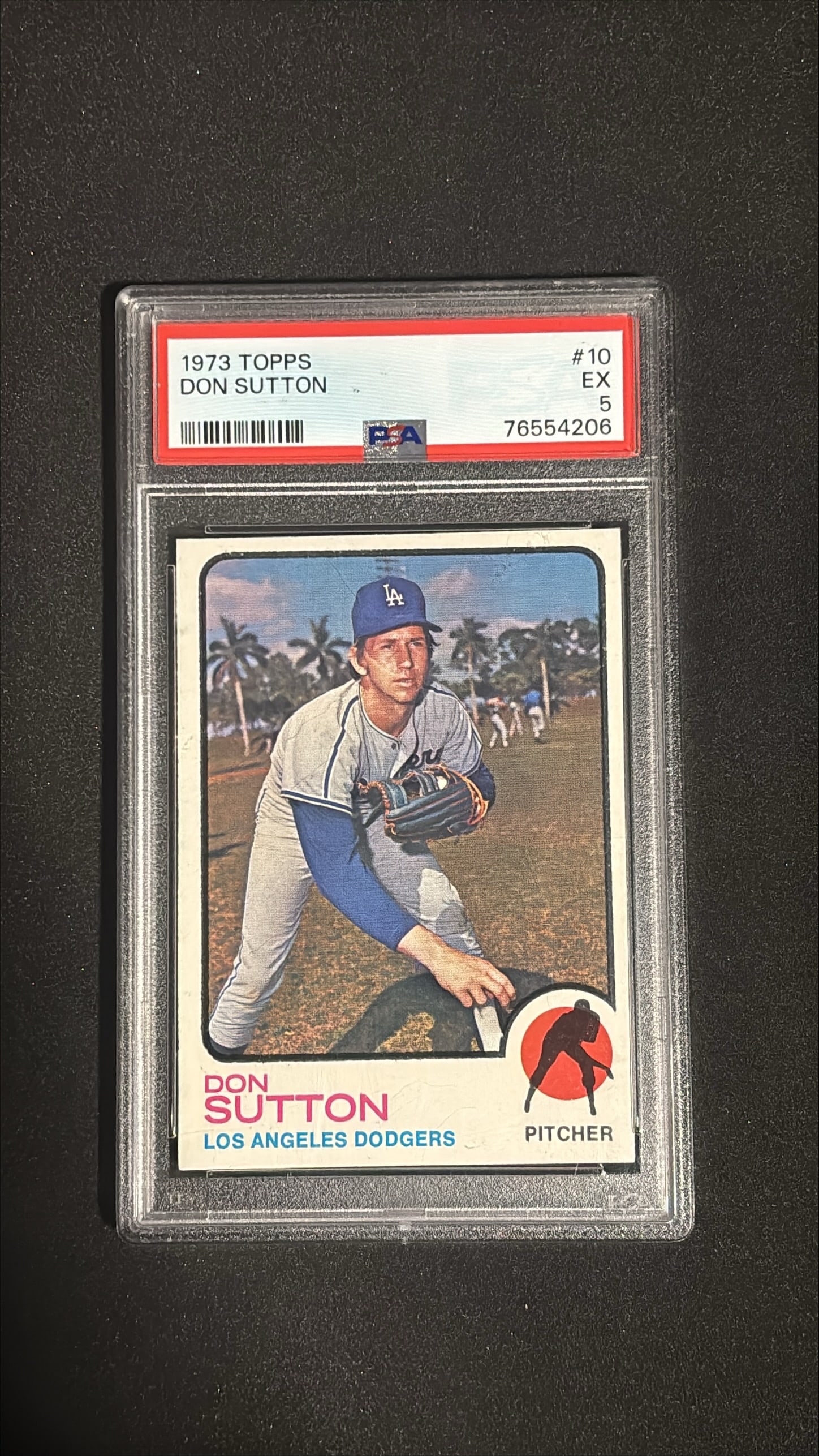 1973 Topps #10 Don Sutton PSA 5 EX - Los Angeles Dodgers: 1973 Topps #10 Don Sutton graded PSA 5 EX. Hall of Fame pitcher, Los Angeles Dodgers, 324 career wins, 4x All-Star, spent majority of career with Dodgers.