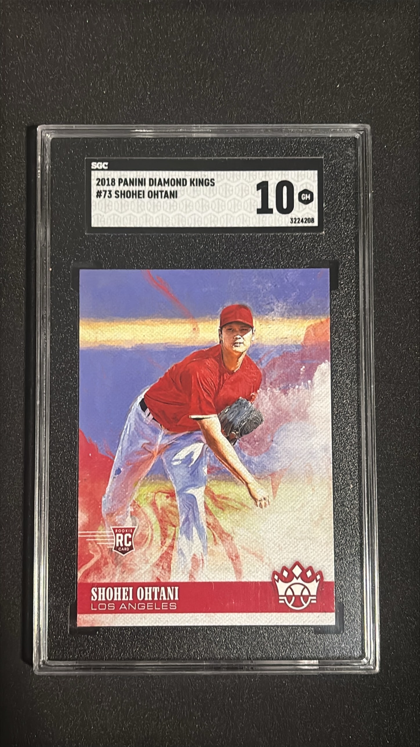 2018 Panini Diamond Kings #73 Shohei Ohtani SGC 10 GEM - Los Angeles Angels Rookie: 2018 Panini Diamond Kings #73 Shohei Ohtani graded SGC 10 GEM. Superstar rookie card, Los Angeles Angels, 2018 MLB Rookie of the Year, pitcher/DH, two-way player, MVP-caliber talent.
