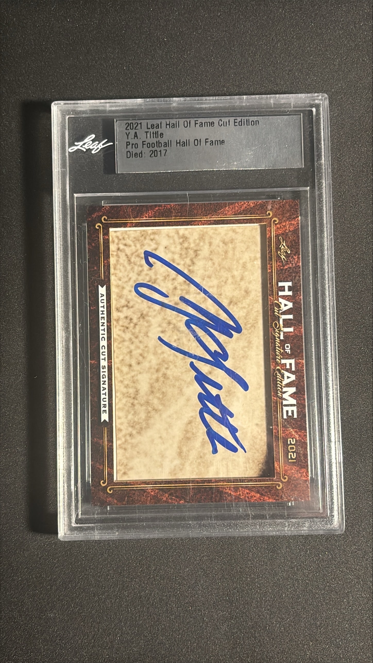 2021 Leaf Hall of Fame Cut Signature Edition Y.A. Tittle Auto: 2021 Leaf Hall of Fame Cut Signature Edition encased card featuring an authentic cut autograph of Y.A. Tittle. The bold blue ink signature is clean and fully visible against the aged cut paper, authen