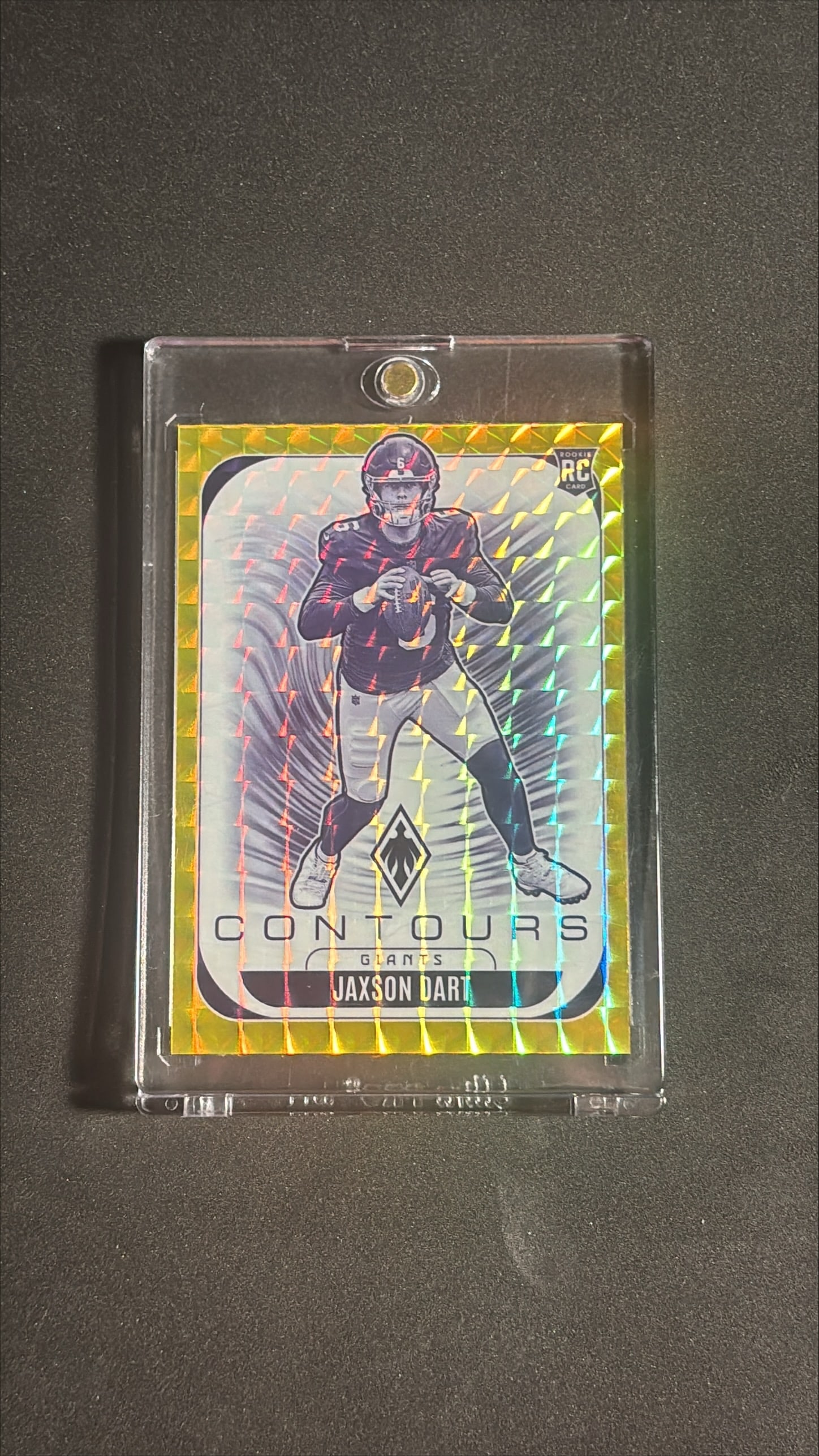2025 Panini Phoenix Contours Jaxson Dart Gold 075/149 Rookie: 2025 Panini Phoenix Contours rookie card of Jaxson Dart, card number 24, Gold parallel numbered 075 of 149, New York Giants. The card features a vibrant gold shimmer background with a bold diamond pat