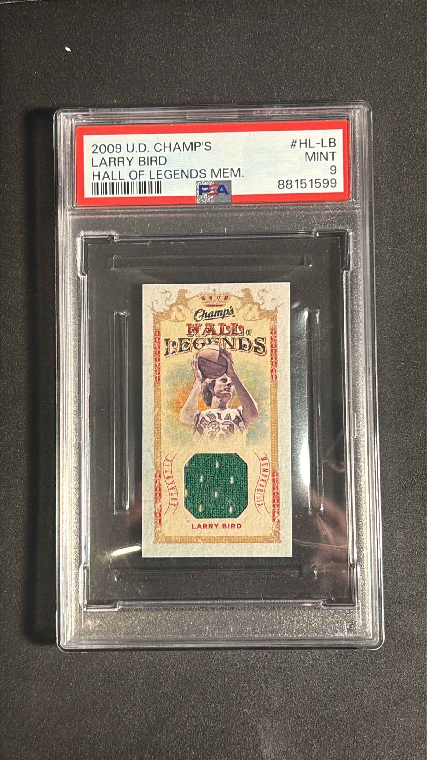 2009-10 Upper Deck Champs Larry Bird Hall of Legends Memorabilia #HL-LB PSA 9: 2009-10 Upper Deck Champs Hall of Legends Memorabilia card number HL-LB featuring an authentic game-used Larry Bird jersey swatch, graded PSA 9 Mint (cert 88151599). The card presents with clean vinta