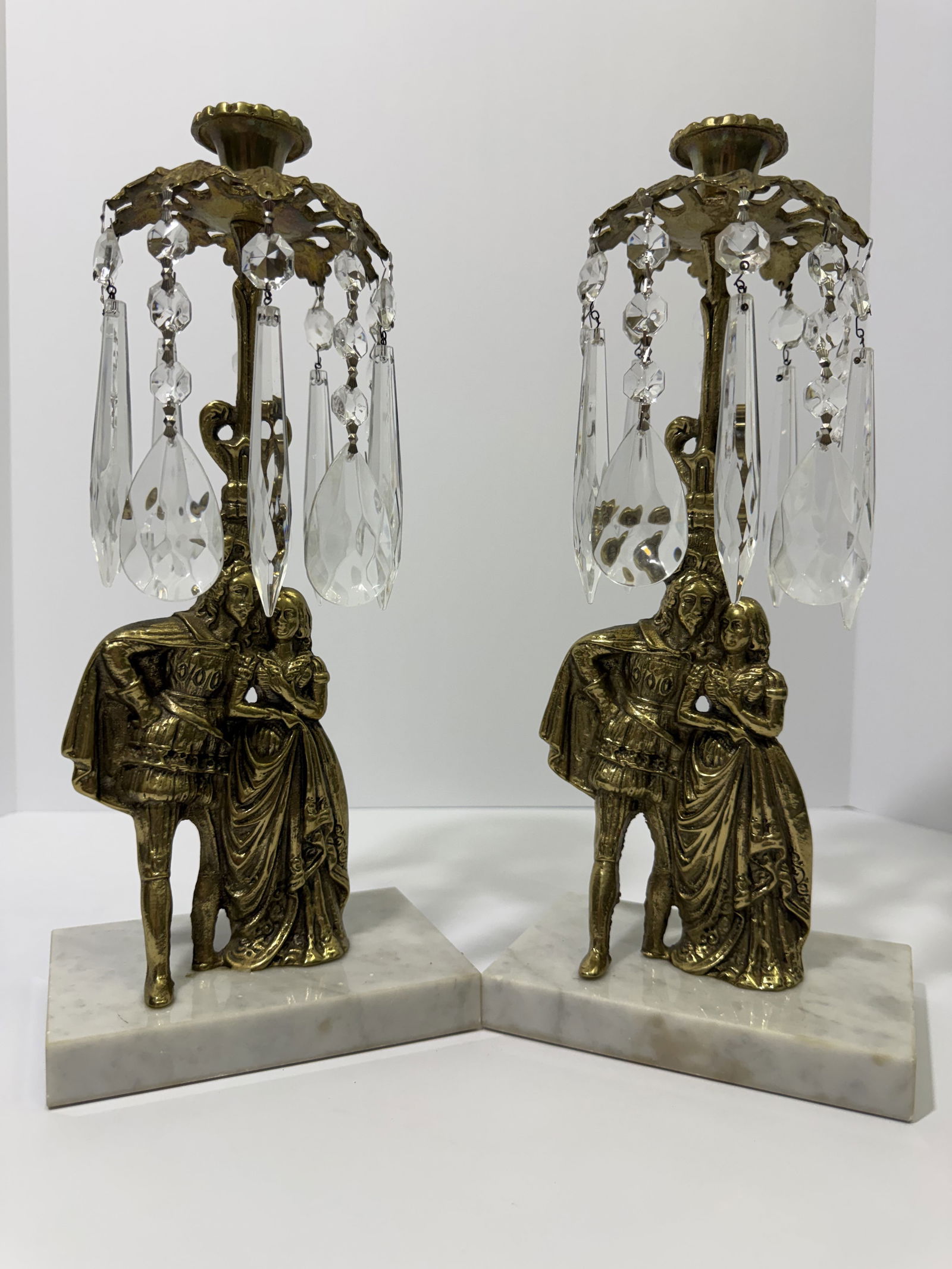 Pair of Glo-Mar Art Works Gilt Figural Girandole Candlesticks with Marble Bases and Crystal Accents: A beautiful pair of mid-century figural girandole candlesticks produced by Glo-Mar Art Works, inc. New York. Each candlestick features a finely cast romantic courtship couple, rendered in gilt metal w