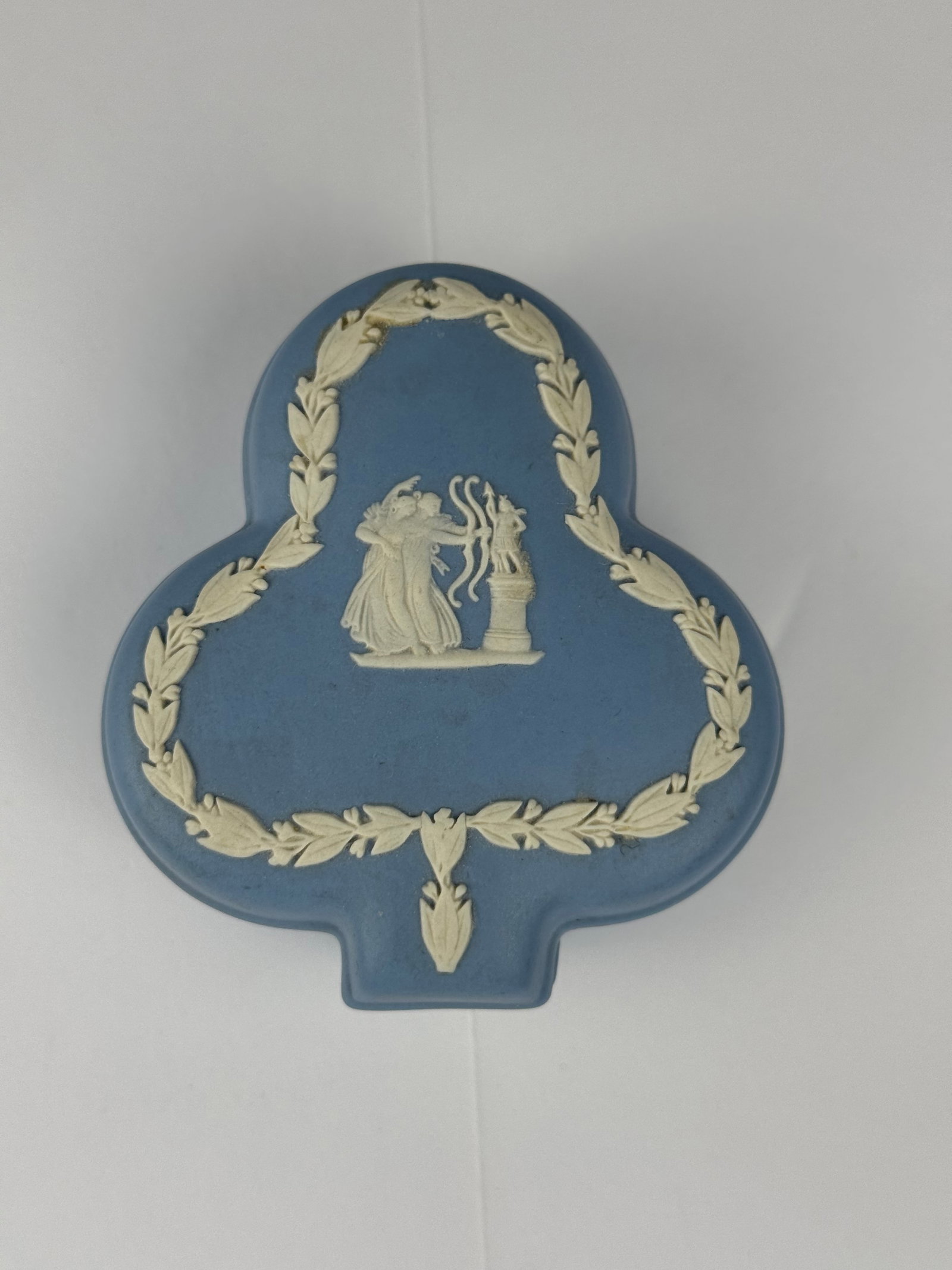 Wedgwood Blue Jasperware Tri-Lobed Covered Trinket Box: A finely modeled Wedgwood blue jasperware tri-lobed covered trinket box, executed in the classical Neoclassical taste and marked “Wedgwood, Made in England” to the underside. The piece feature