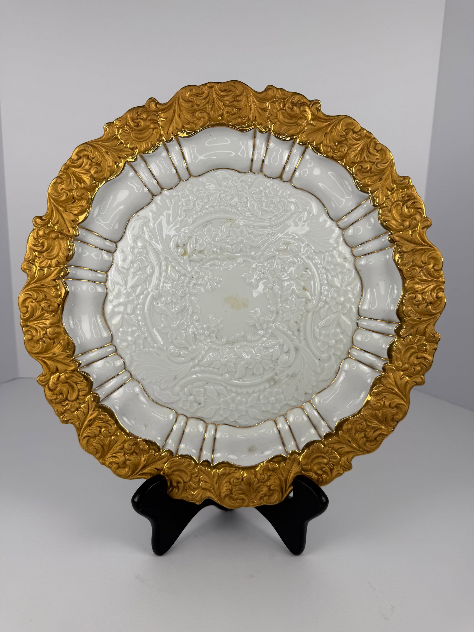 Antique Meissen Gilt Porcelain Charger: An exceptional antique Meissen porcelain charger featuring lavish raised gilt decoration and an intricately molded relief design throughout. This elegant European porcelain piece displays a richly orn