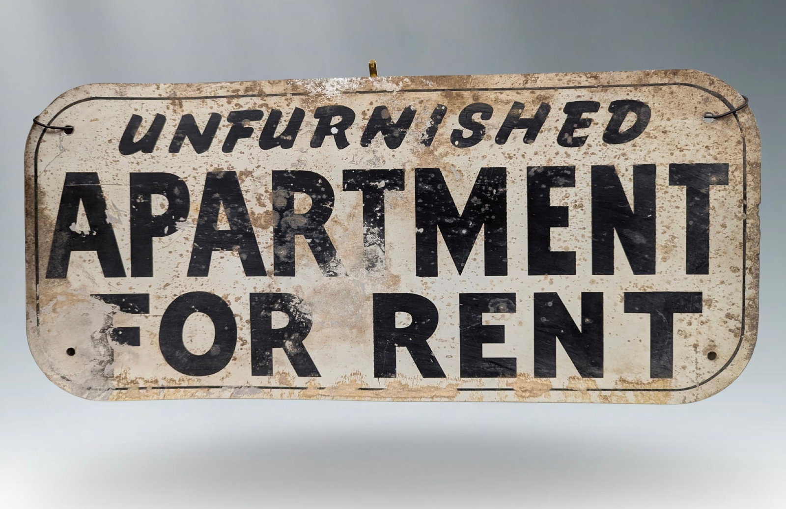 Vintage Metal "UNFURNISHED APARTMENT FOR RENT" Real Estate Sign: Authentic vintage rental sign. This piece is a tangible link to the past, likely having been hung on countless porches and apartment buildings. The mix of a casual script for "Unfurnished" and a bold,