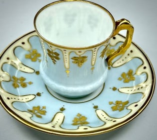Antique Porcelain Demitasse Cup and Saucer with Gilded Accents