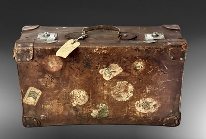 Vintage Leather Suitcase with Travel Stickers