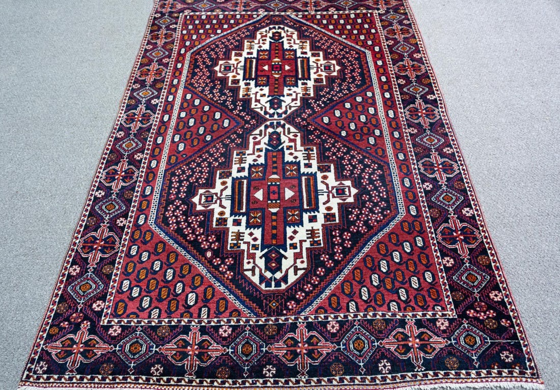 HandmadePersian Afshar Rug 5'4" x 7'6": Handmade Persian Afshar rug. Size 5'4" x 7'6" ft, made of high-quality wool on cotton foundation, incorporating tribal and floral patterns on a navy blue and red background and framed beautifully by a
