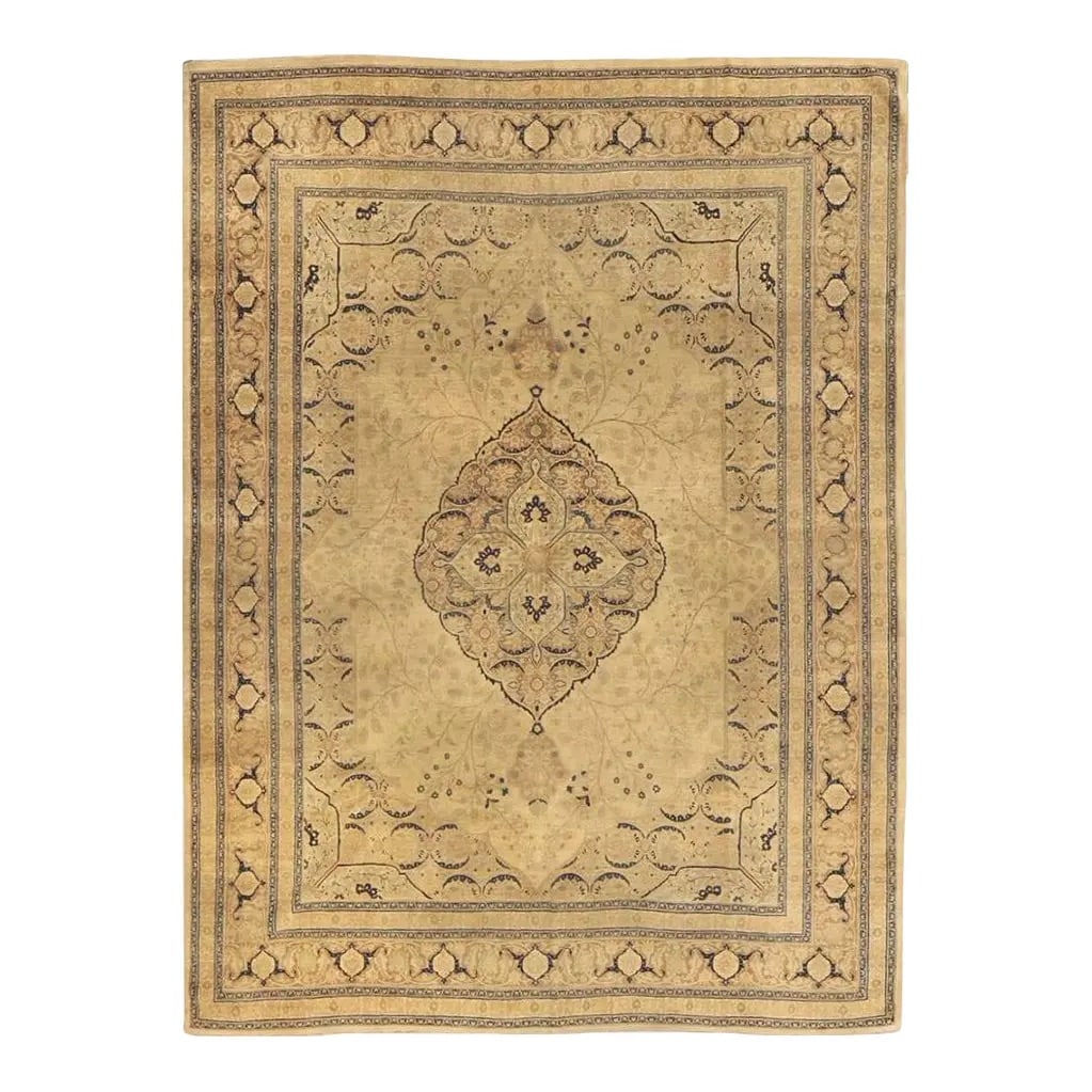 Antique Persian Tabriz Hadji Jalili Rug 9'3" X 12'2": Antique Persian Tabriz Hadji Jalili (Haji Jalili) hand-knotted wool rug, circa late 19th to early 20th century (c. 1880-1920), with a soft beige field and a central medallion, surrounded by an open fl