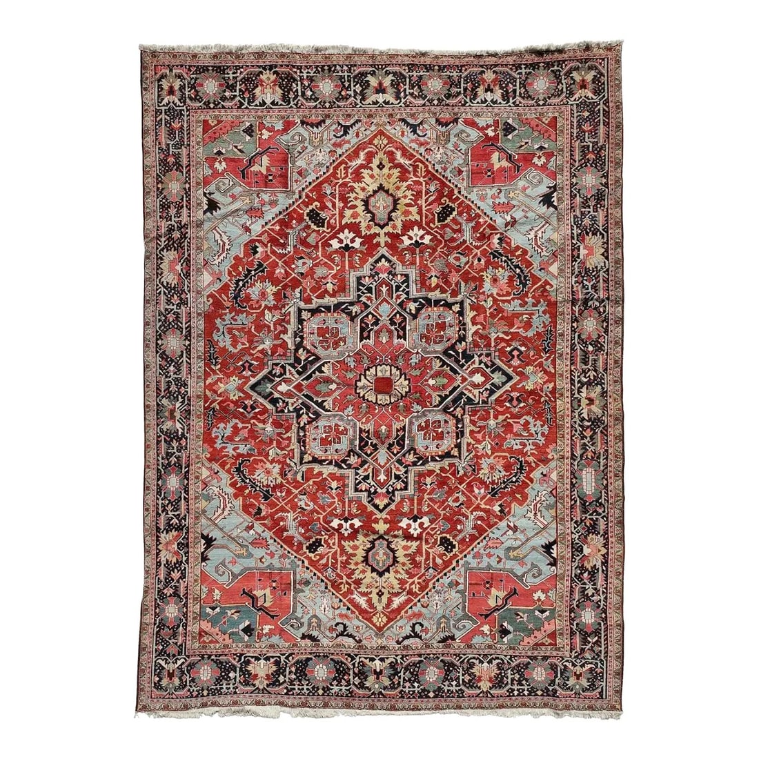 Antique Persian Heriz/Serapi Rug 12'5" X 16'5": Antique hand-knotted Heriz/Serapi wool rug, circa 1880-1900, with a brick-red field and a large geometric central medallion. The design includes angular floral and vinery motifs, with corner spandrels