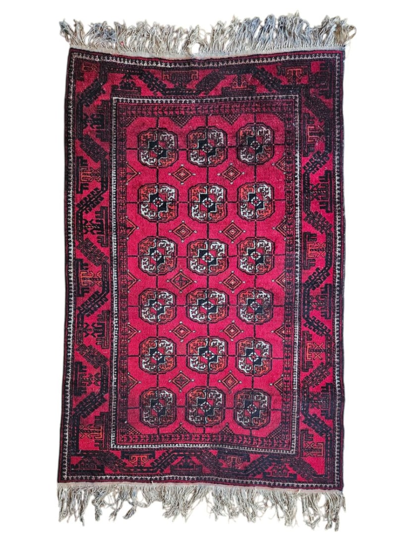 Vintage Teyis Afghan Kunduz Rug 3'8" x 5'8": Vintage Tayis Afghan Kondouz tribal rug featuring a deep red field with repeating geometric motifs and a defined central composition. Dark charcoal, black, ivory, and muted blue accents appear through