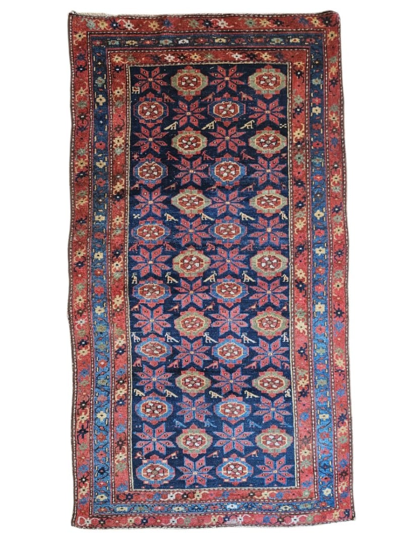 Antique Persian Veramin Rug 3'7" x 6'8": Antique Persian Veramin rug featuring a central field with repeating floral and geometric motifs arranged in vertical and horizontal patterns, surrounded by multiple decorative borders. Woven in red, 