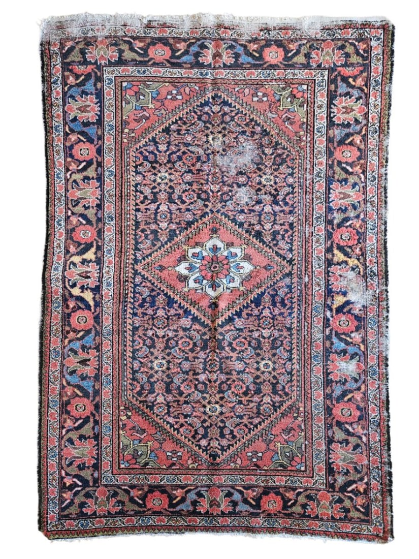 Antique Persian Hamadan Rug 4'8" x 7'1": Antique Persian Hamadan rug featuring a central geometric medallion surrounded by floral and botanical motifs, with a detailed patterned border. Woven in deep red, navy blue, cream, and muted earthy t