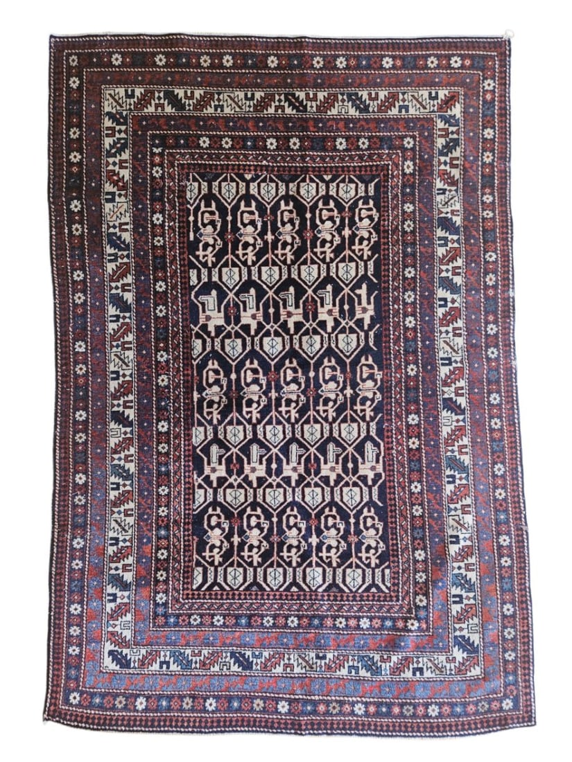 Antique Caucasian Kazak-Style Rug 4'1" x 6': Antique Caucasian Kazak-style tribal rug featuring a dark central field with repeating geometric and stylized floral motifs, surrounded by multiple patterned borders. Woven in red, blue, ivory, brown,