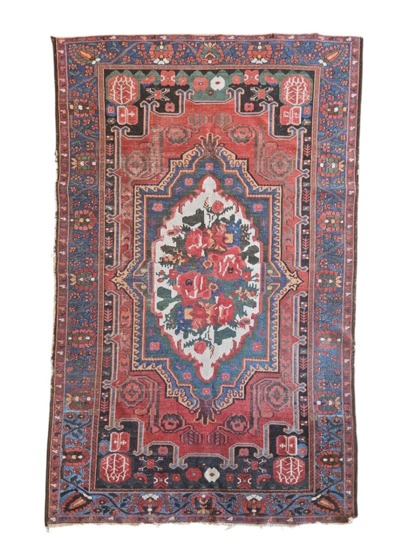 Antique Caucasian Karabagh Rug 4'6" x 7'2": Antique Caucasian Karabagh-style rug featuring a central floral medallion surrounded by stylized floral and geometric motifs, with multiple patterned borders. Woven in deep red, blue, ivory, rust, and