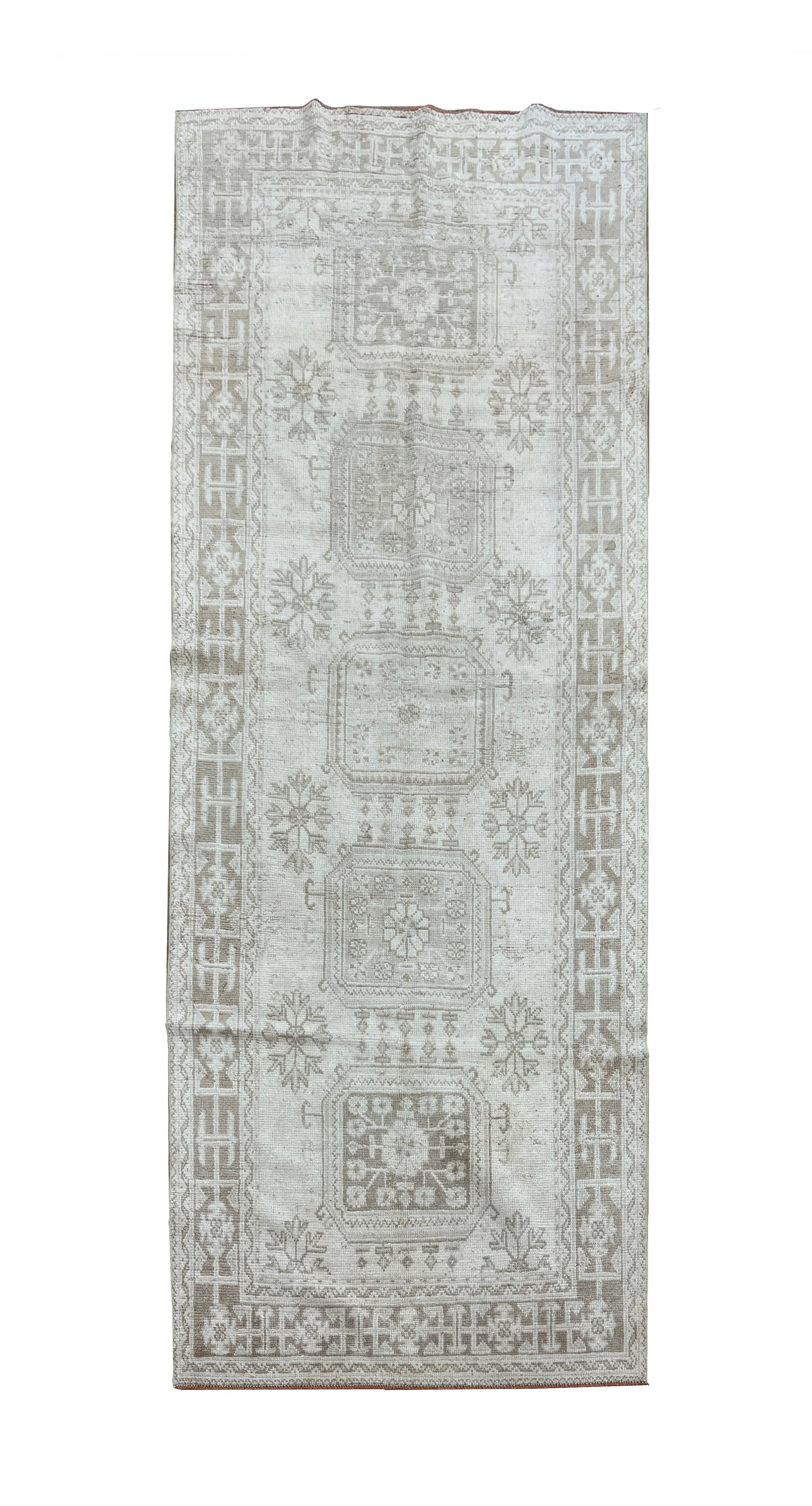 Vintage Turkish Hand Knotted Wool Runner 4'5" x 11': Vintage Turkish runner, hand knotted in Turkey from 100% wool. Measuring 4'5" x 11', the rug features a traditional geometric design with a series of rectangular medallions arranged along the central 