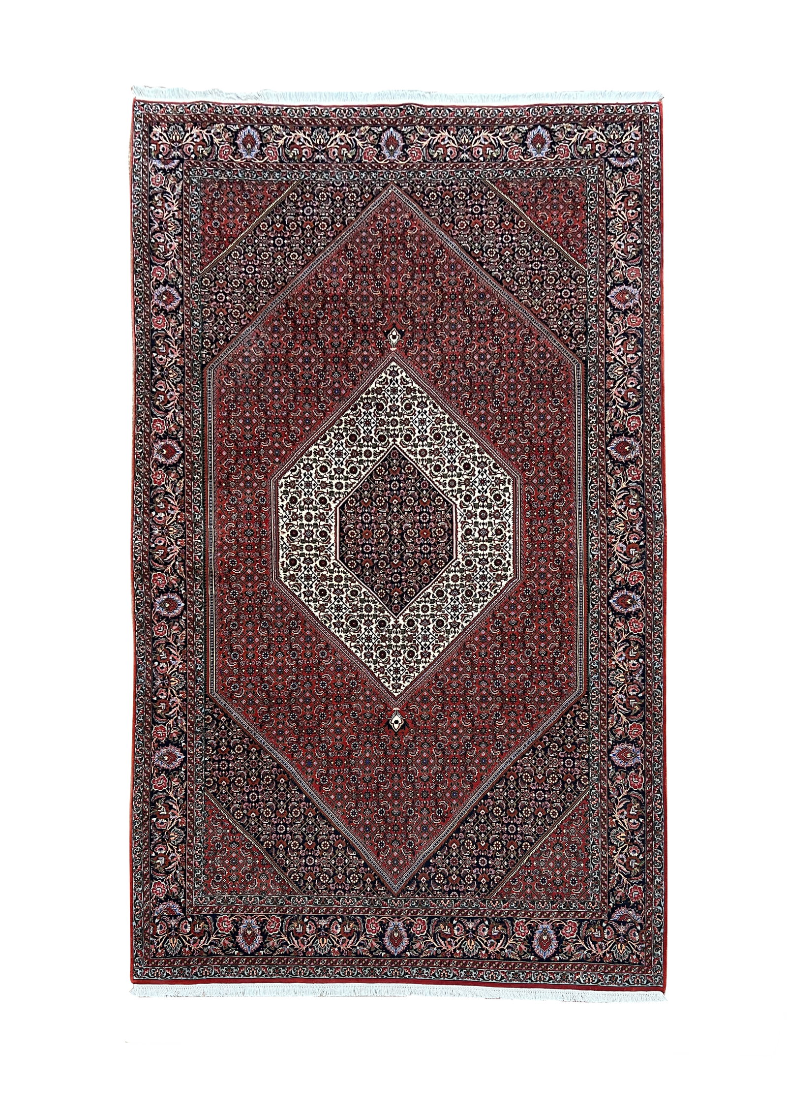 Persian Bijar Hand Knotted Wool Rug 6'10" x 10'3": Persian Bijar rug, hand knotted in Iran from 100% wool. Measuring 6'10" x 10'3", the rug features a traditional geometric medallion design with a prominent ivory center surrounded by a rich deep red a