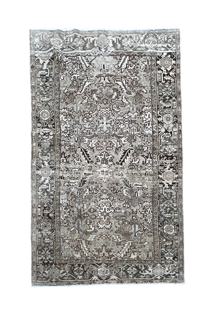 Vintage Persian Heriz Wool Rug 6'3" x 8'11": Vintage Persian Heriz rug, hand knotted in Iran from 100% wool. Measuring 6'3" x 8'11", the rug features a bold geometric allover design with stylized floral motifs and angular forms arranged across t