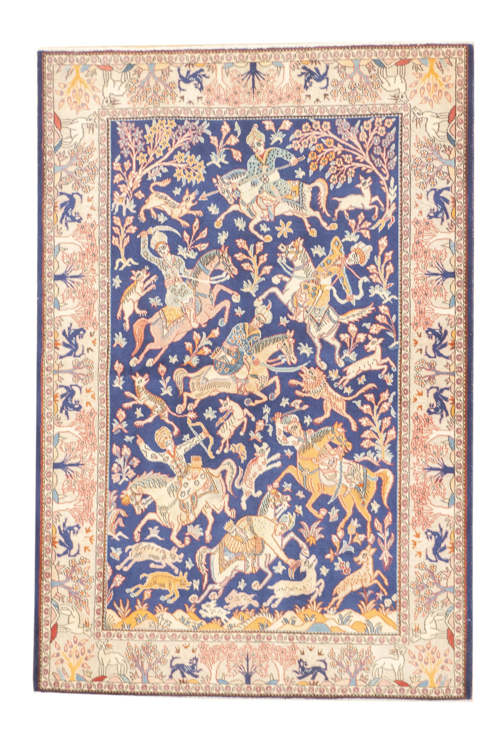 Vintage Persian Isfahan Rug 4'5" x 6'7": Hand-knotted Persian Isfahan rug, vintage. Woven in wool. The rug depicts a hunting scene with mounted figures, animals, and stylized foliage set within a detailed field. Framed by a multi-band border