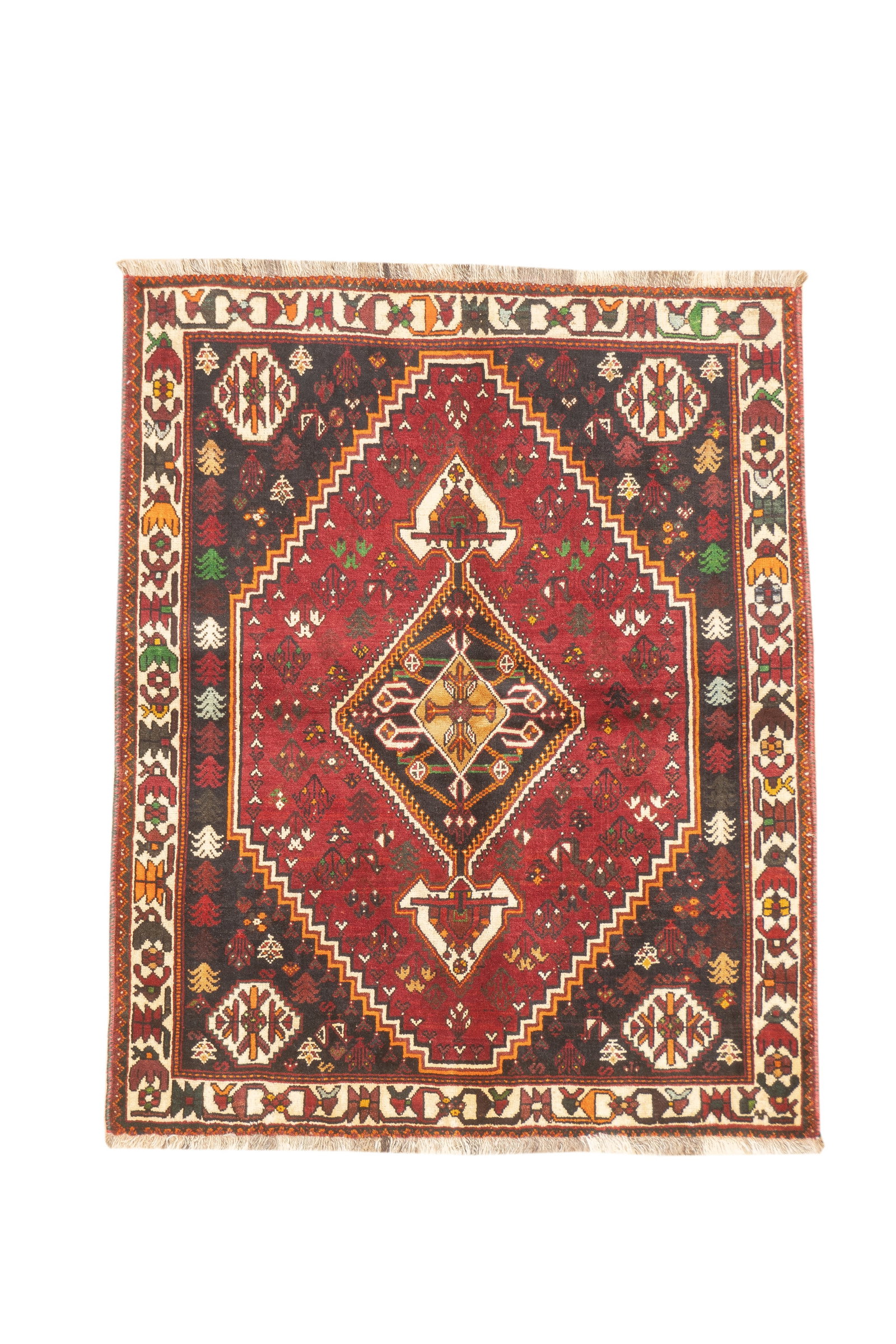 Vintage Persian Qashqai Rug 4'6" x 5'6": Vintage Persian Qashqai hand-knotted rug featuring a bold tribal geometric design centered around a stepped diamond medallion. The composition includes stylized motifs and corner elements set against 