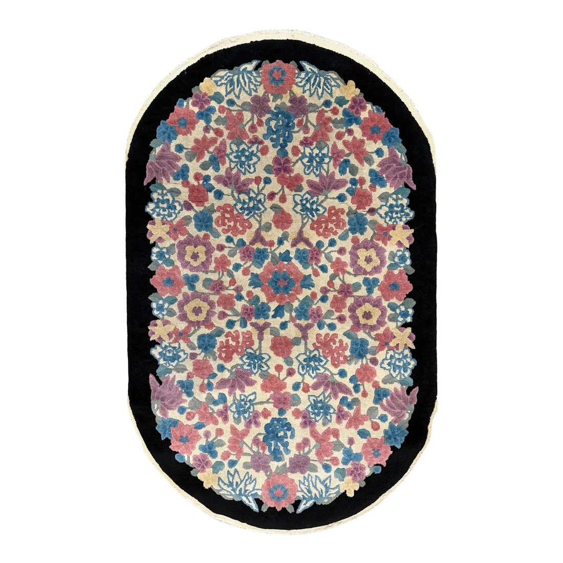 Mid-20th C Entury Chinese Art Deco Oval Rug 3'1" X 4'11": Hand-knotted wool rug measuring 3'1" x 4'11", featuring an oval format with an allover floral pattern on an ivory field and a black border. The design includes stylized flowers and foliage in shades o