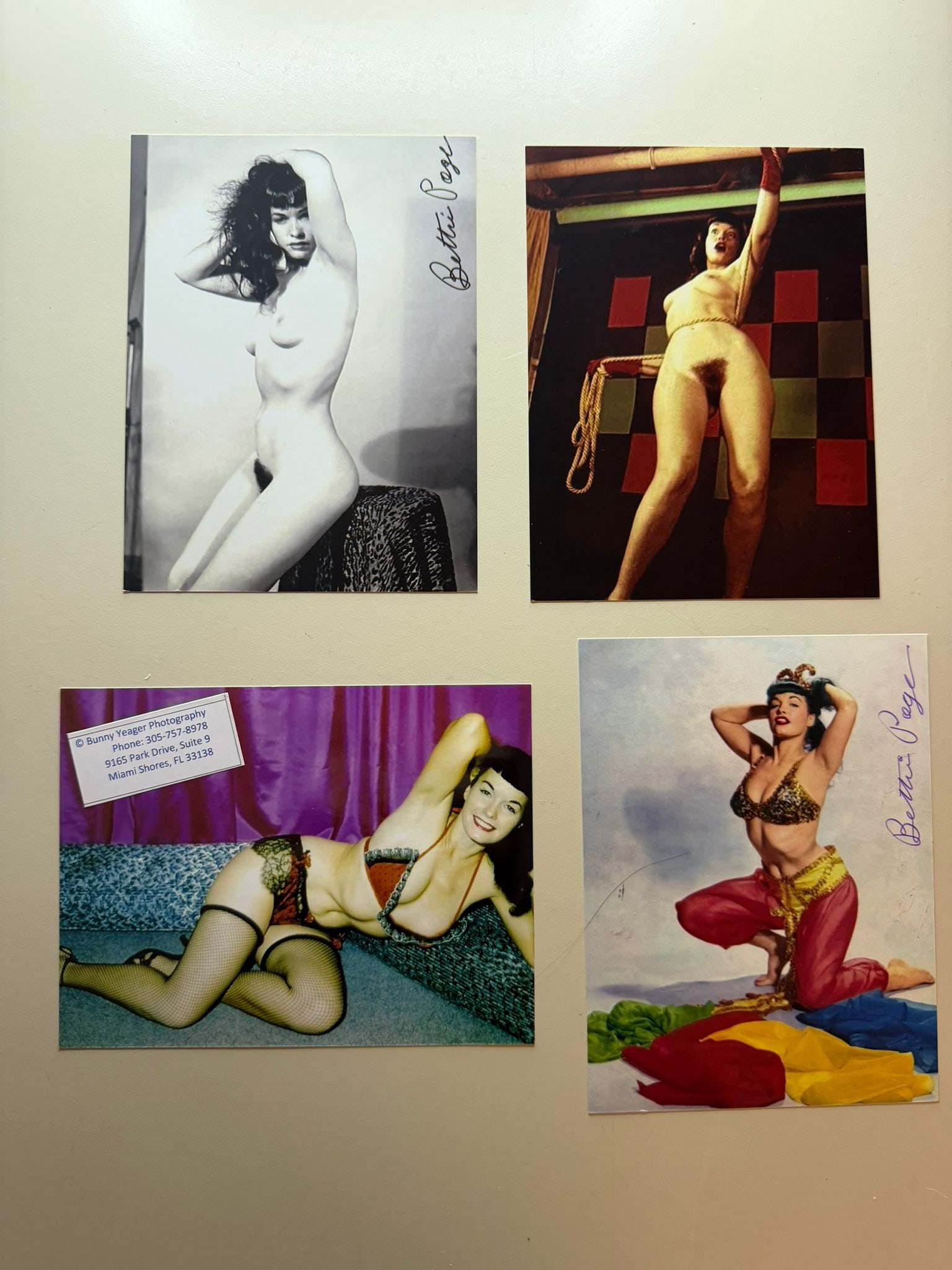 Bettie Page – Set of 4 Signed Photographs – Bunny Yeager Studio – Iconic Pin-Up Images: Lot of four original photographs depicting Bettie Page, one of the most iconic figures in 20th-century pin-up photography, produced by the studio of renowned photographer Bunny Yeager.The photographs