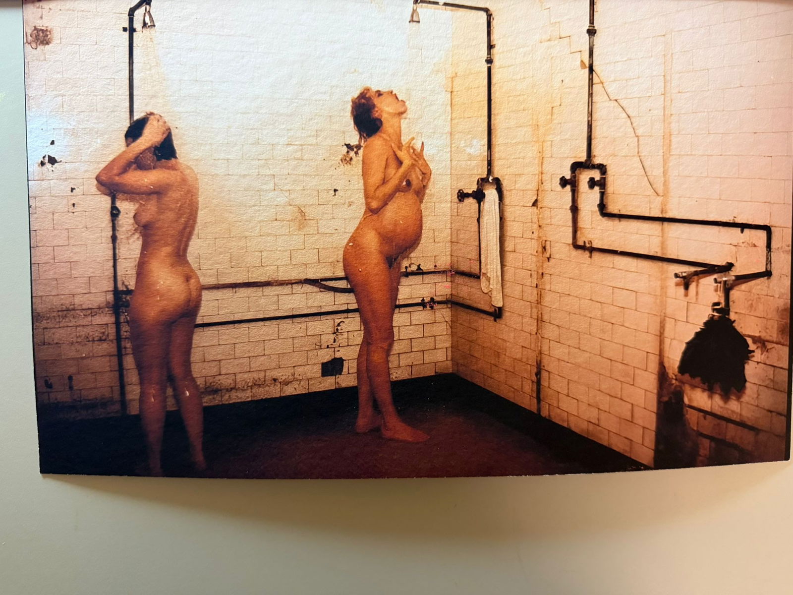 Nan Goldin – Rebecca and Janet in the Shower at the Russian Baths, 1985: - Artist: Nan Goldin- Title: Rebecca and Janet in the Shower at the Russian Baths- Year: 1988- Medium: Photograph on baryta paper- Signature: Signed, with handwritten dedication on verso- Dimensions: