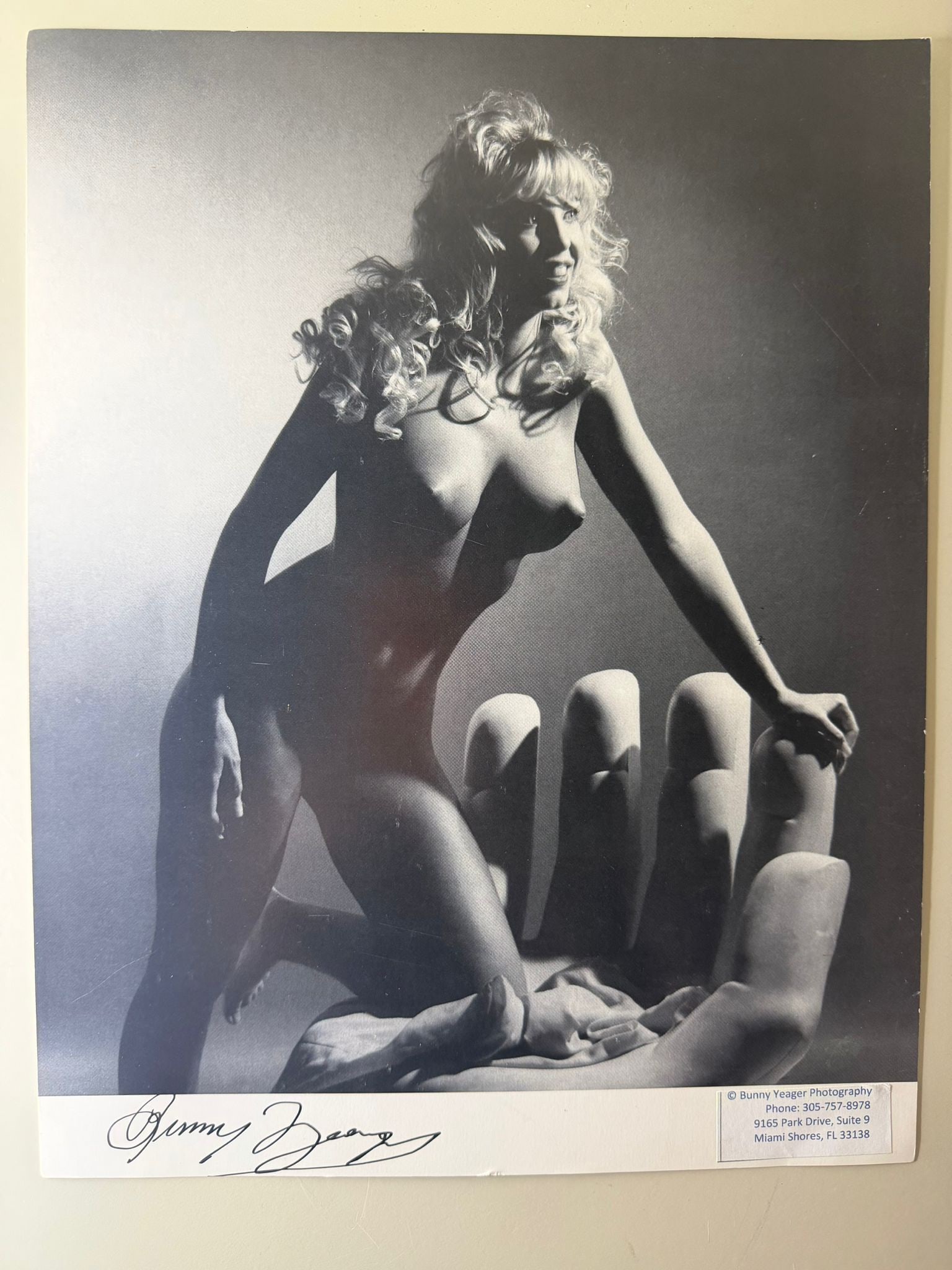 Bunny Yeager – Signed Photographic Print, Black & White Nude Study: Black and white photographic print after an original image by renowned American photographer Bunny Yeager, depicting one of her iconic glamour nude studies. Hand-signed by Bunny Yeager in ink in the l